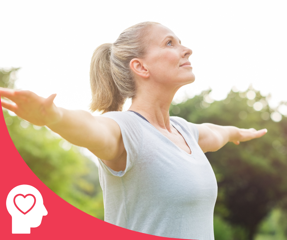 woman outside with arms out doing gentle exercise