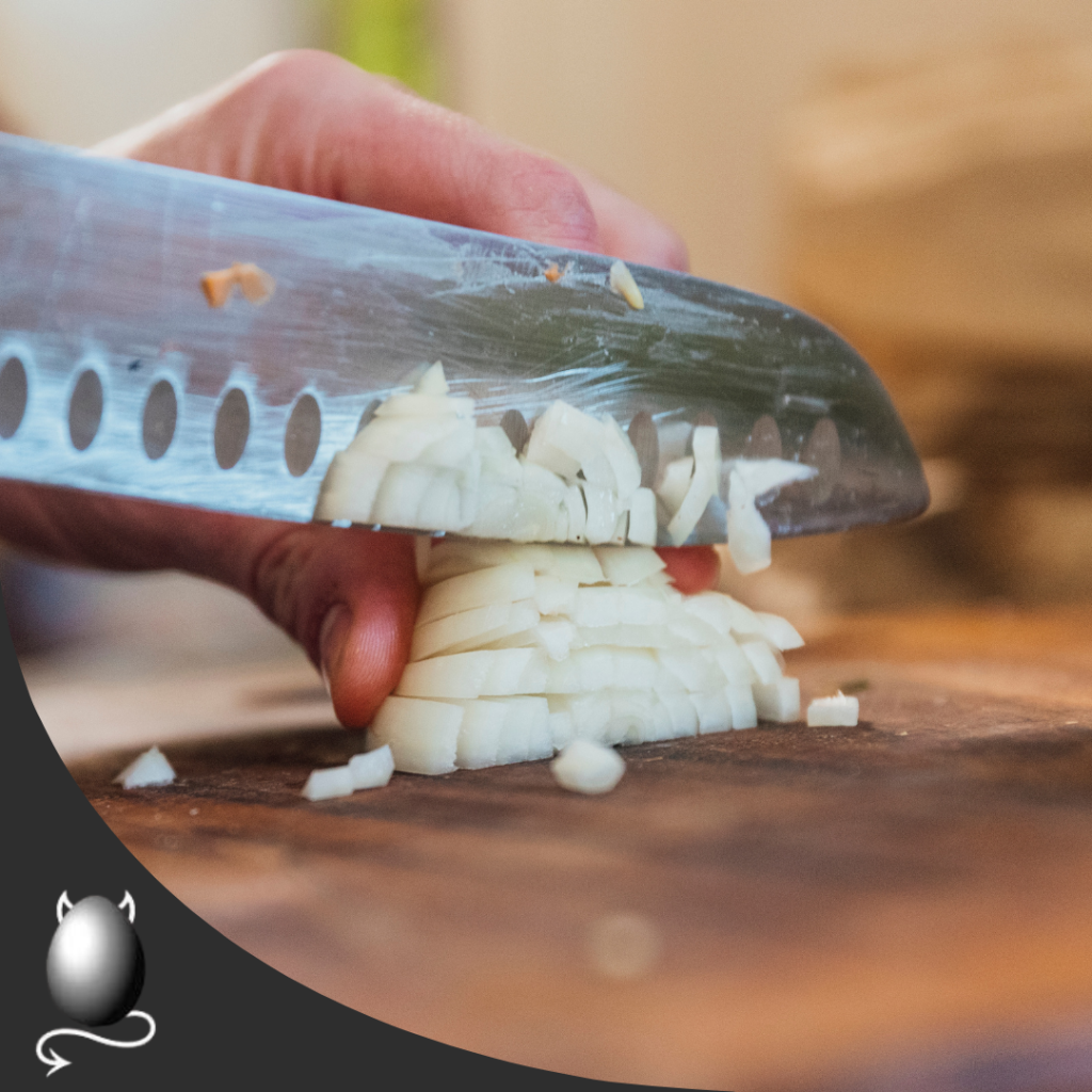 knife dicing an onion