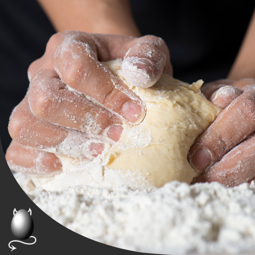 hands kneading dough