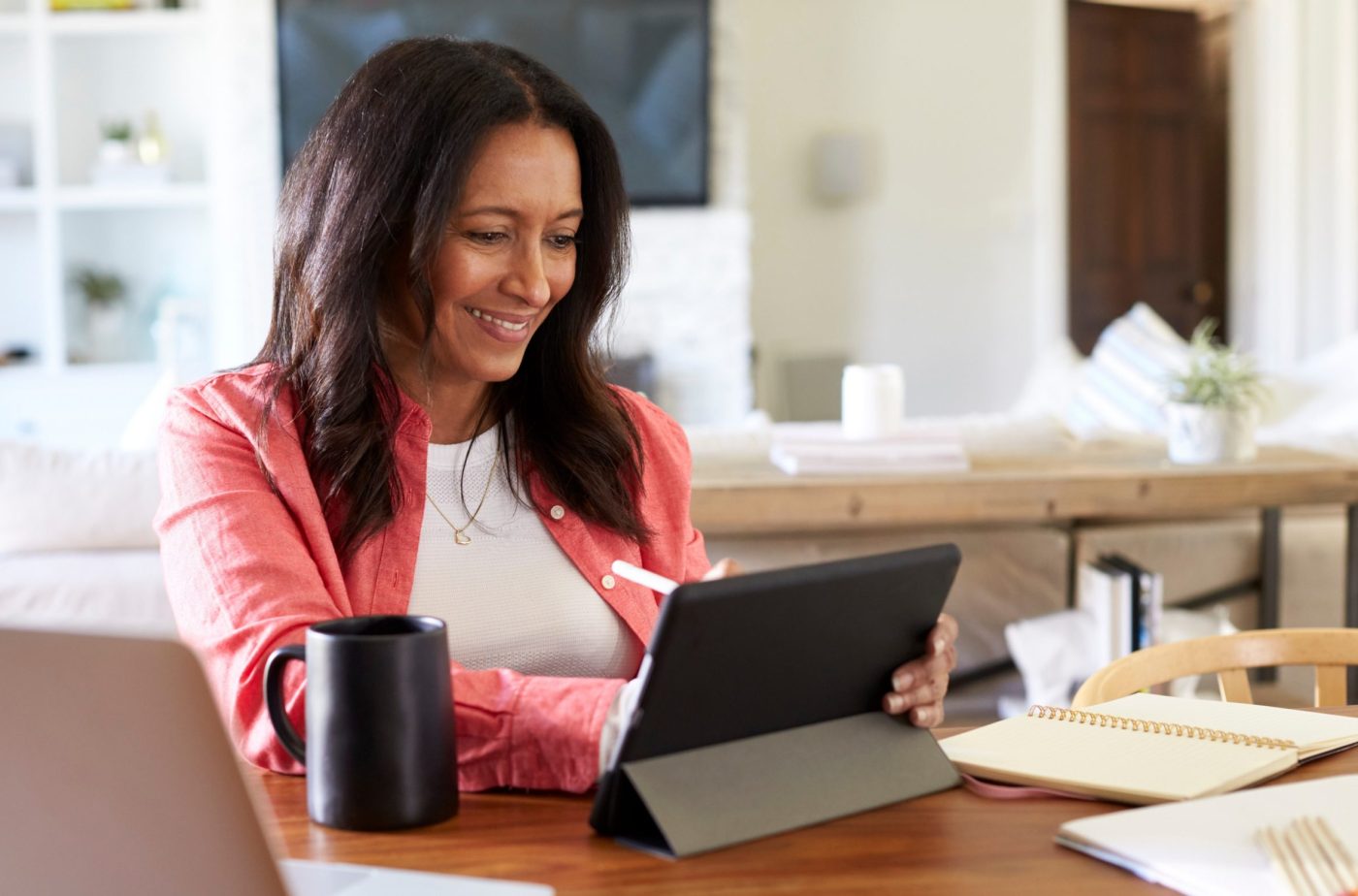 woman using digital tablet